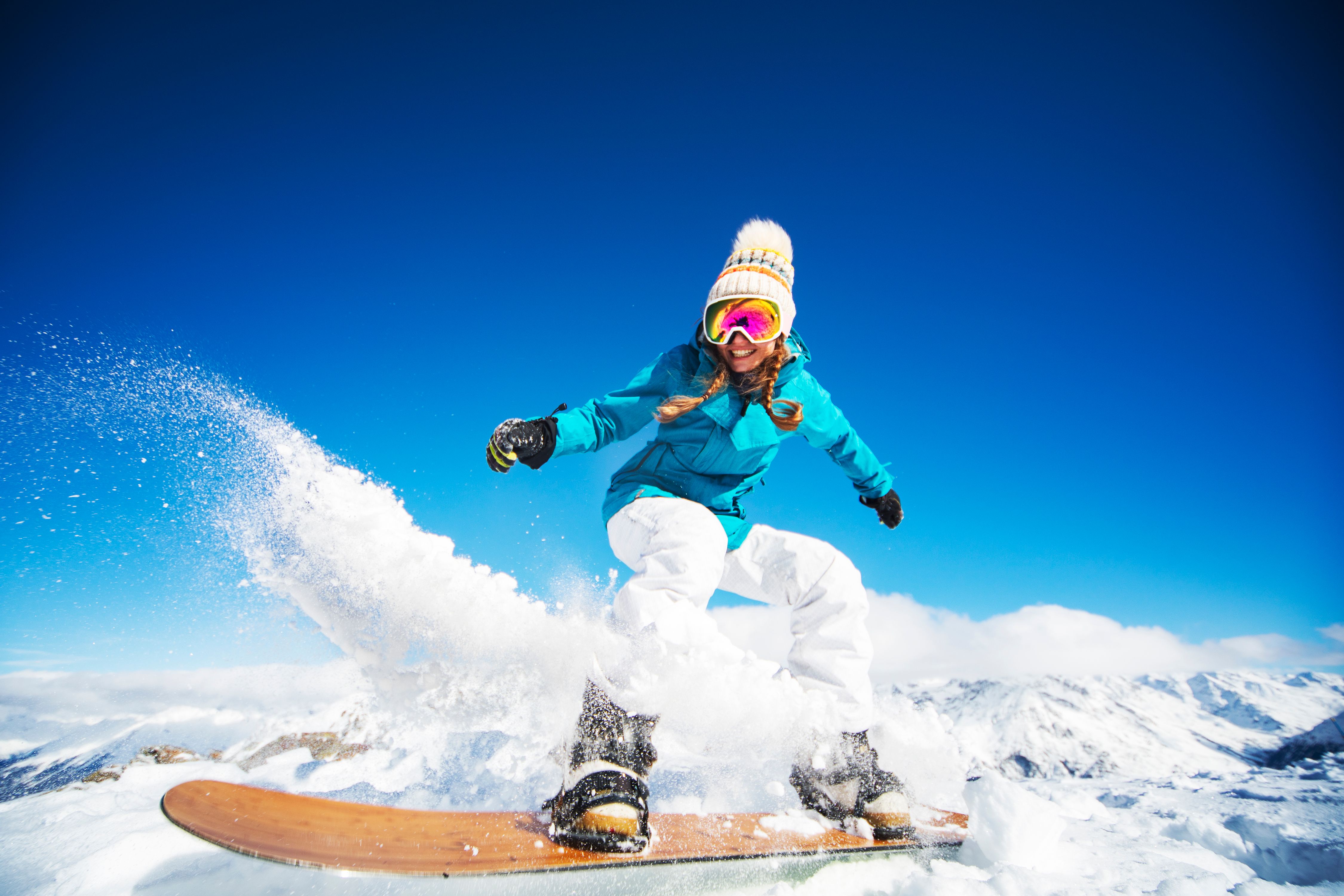 Lady on snow board in the Alps