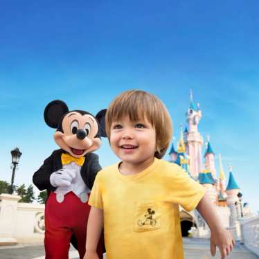 Disneyland Paris - little boy and Micky Mouse