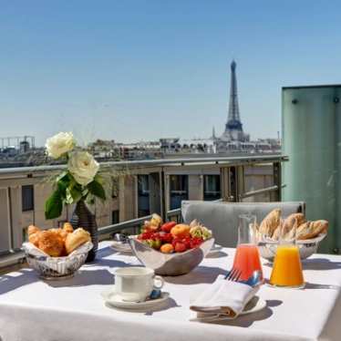 Breakfast on terrace with view on Eiffel Tower