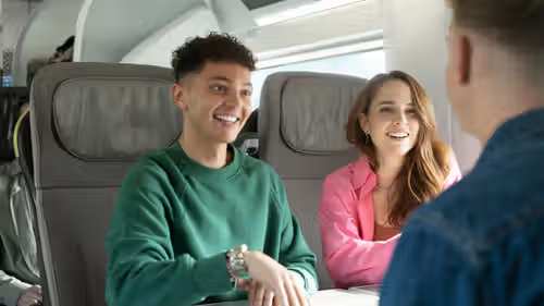 Three young people traveling aboard the Eurostar