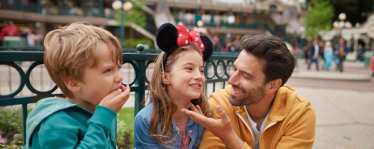 Family at DIsneyland Paris with Mickey Mouse ears on