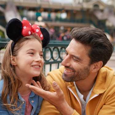 Family at DIsneyland Paris with Mickey Mouse ears on