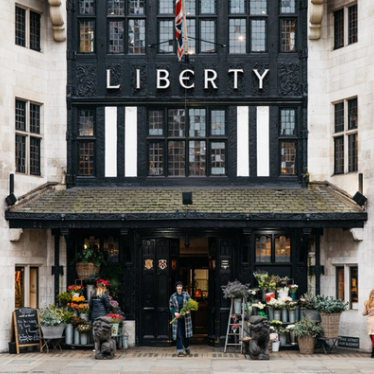 People buying flowers outside Liberty department store in London.