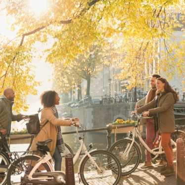 Friends on bike in Autumn in Amsterdam