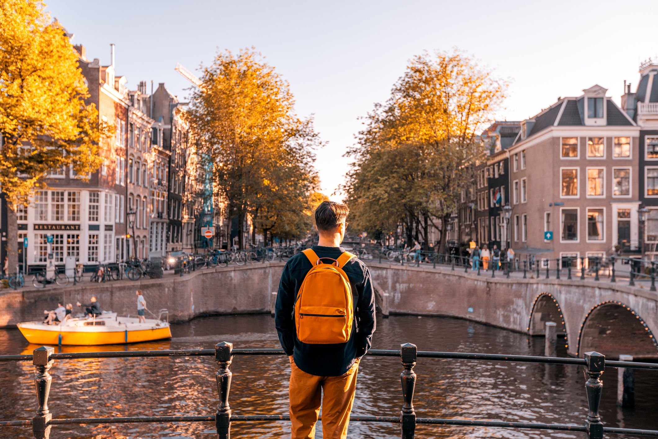 Amsterdam in Autumn, person looking out over canal