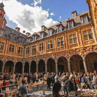 Vieille Bourse, full of tourists on a sunny day