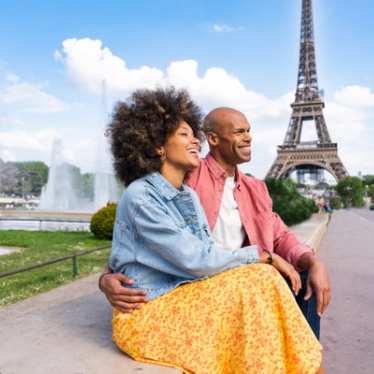 Happy couple in Paris by the Eiffel Tower