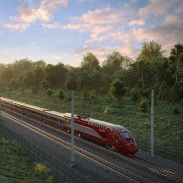 A red Eurostar train going at speed