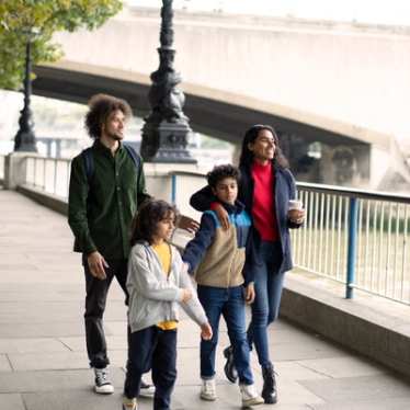 London - family - walking along the Thames - Delta