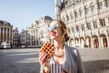 Brussels - Grand Place - Lady eating waffle