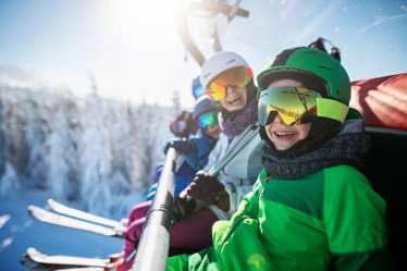 Children smiling on thier skiing holiday