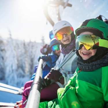 Children smiling on thier skiing holiday