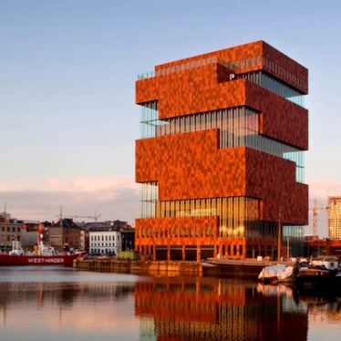 The unique architecture of the MAS in Antwerp across the water.