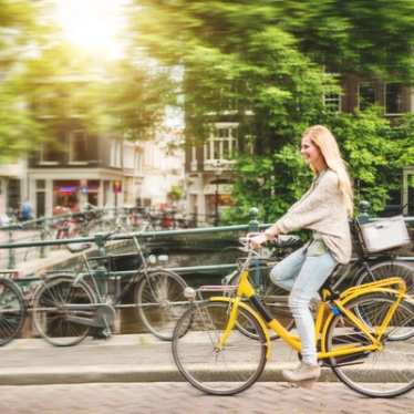 Woman cycling in Amsterdam