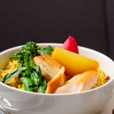 A bowl of healthy, colourful food, and a side order of something sweet with a coffee.