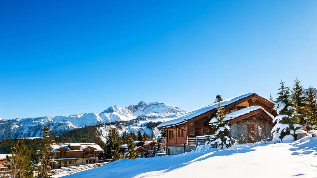 A view of a ski resort in the French Alps on a winter day.