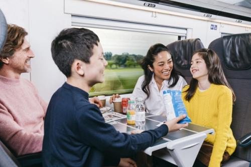 Standard Class - Eurostar train - onboard - family sitting around table - Travel classes