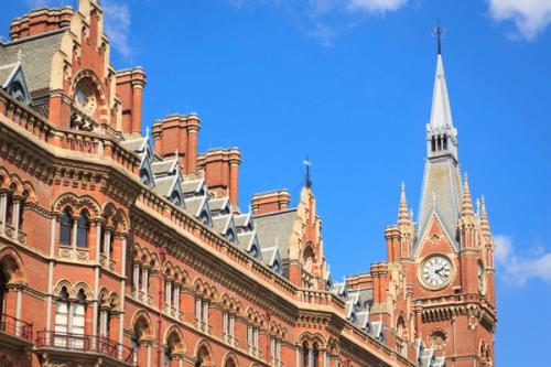 Clock tower of St Pancras International station on a sunny day.