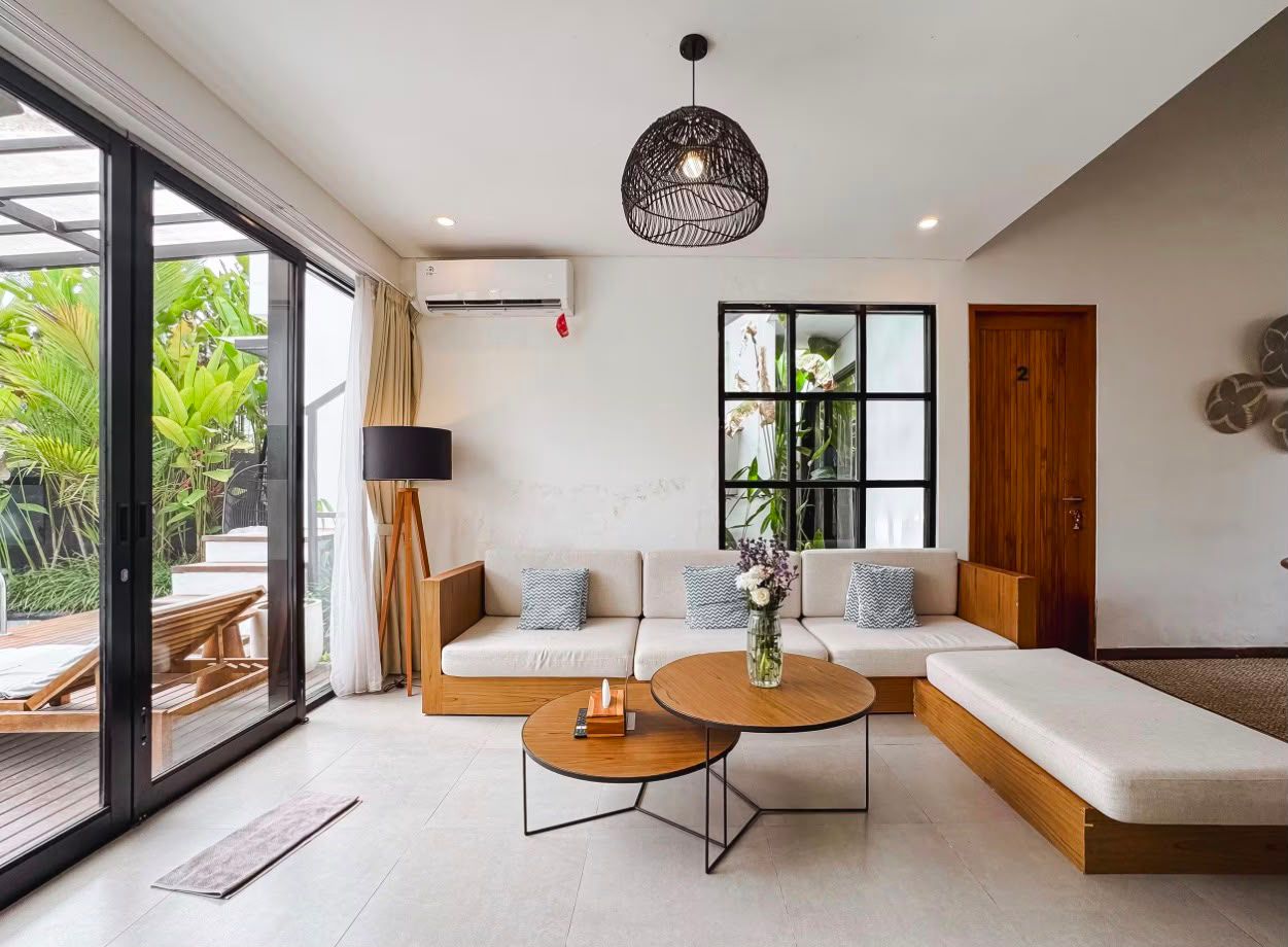 Dining table and kitchen beyond the living area