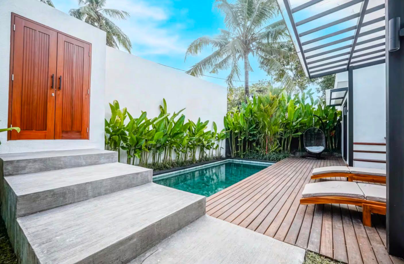 Villa exterior seen across the pool