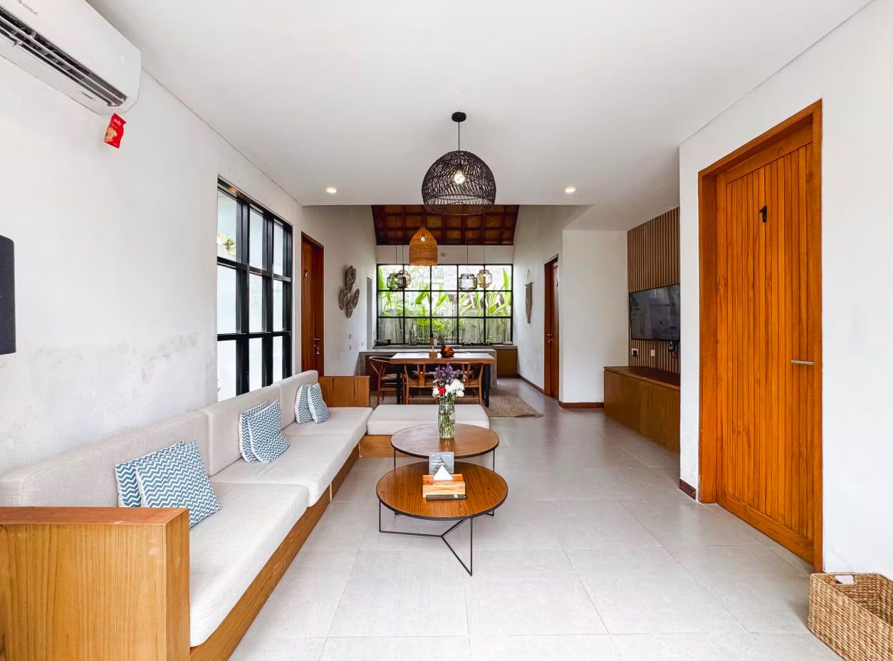 Living room seating area with woven pendant light