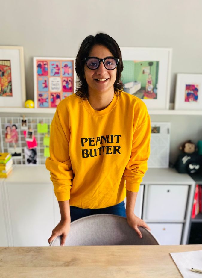 Woman wearing a sweater written Peanut Butter 