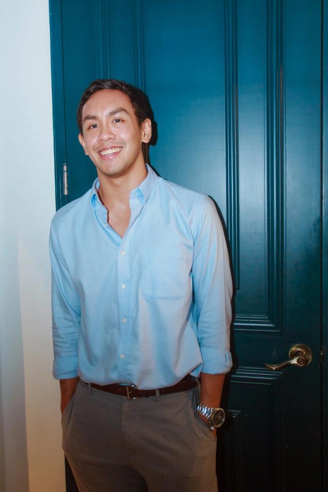 A man in light blue shirt is smiling