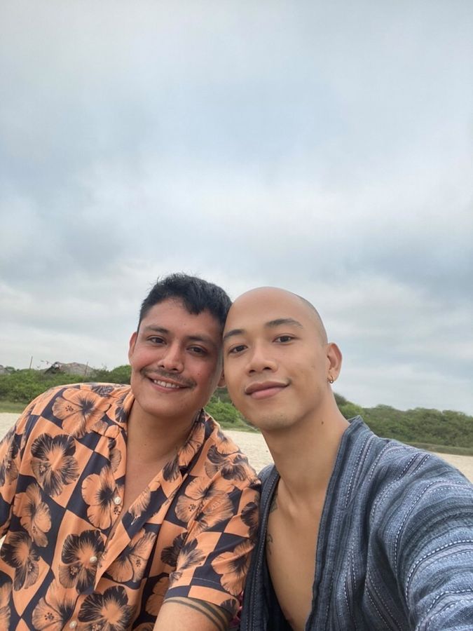 Gay couple smiling to the camera