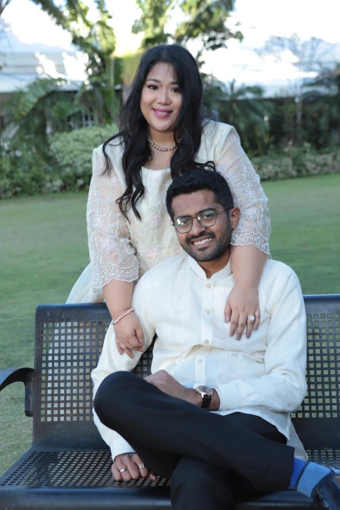 A woman and a man in white clothes