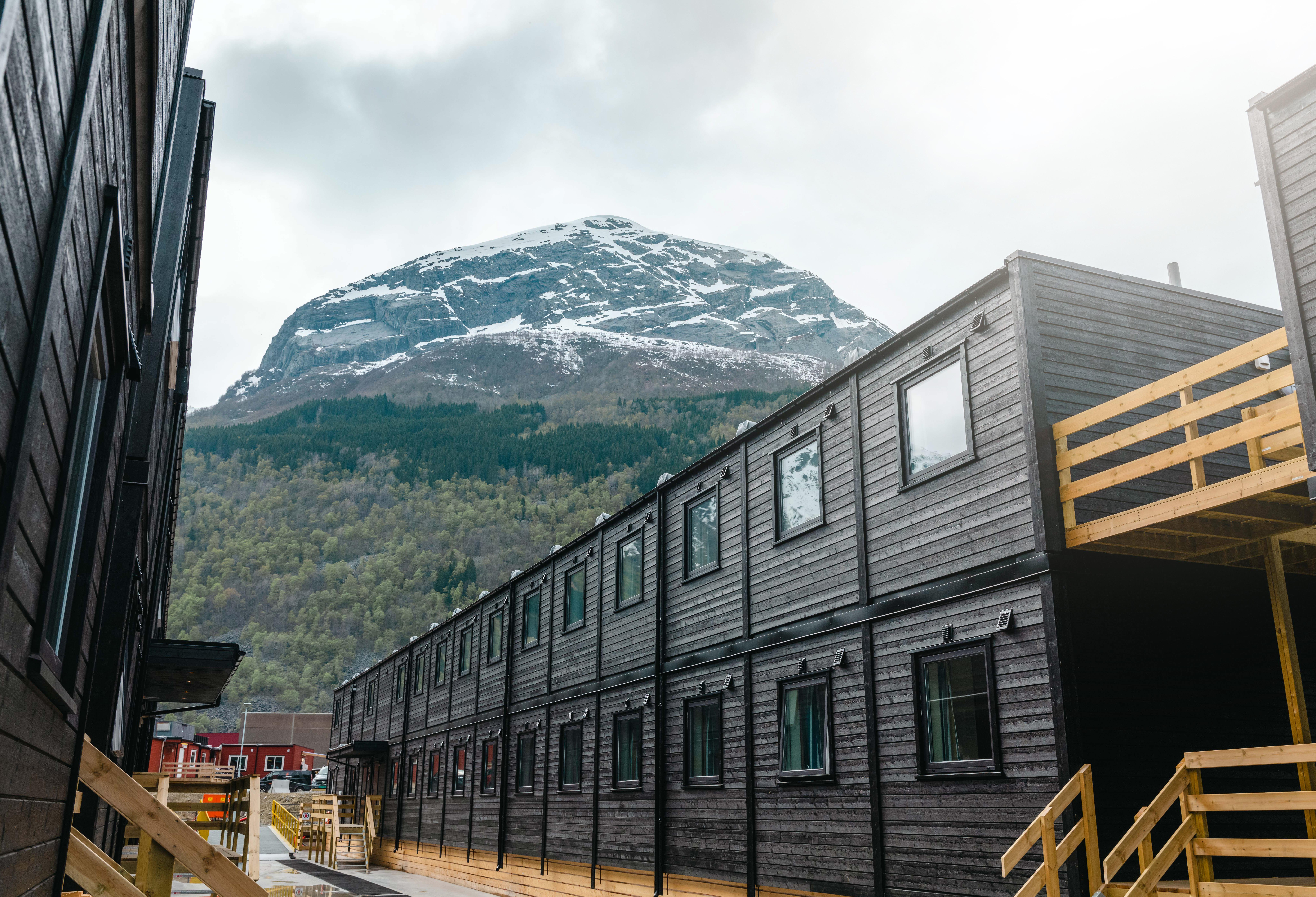 Barracks for accommodation at camps with mountains in the background