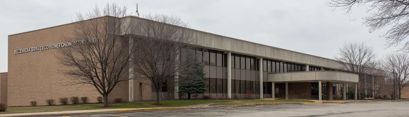 The Corliss Pike main campus building from the parking lot.