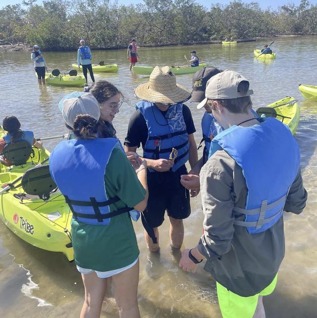 A kayaker paddles open water