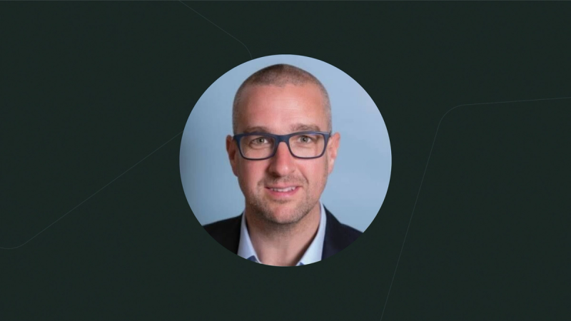 Image of Ed Hill, VP Revenue, in a blue circle on a dark background