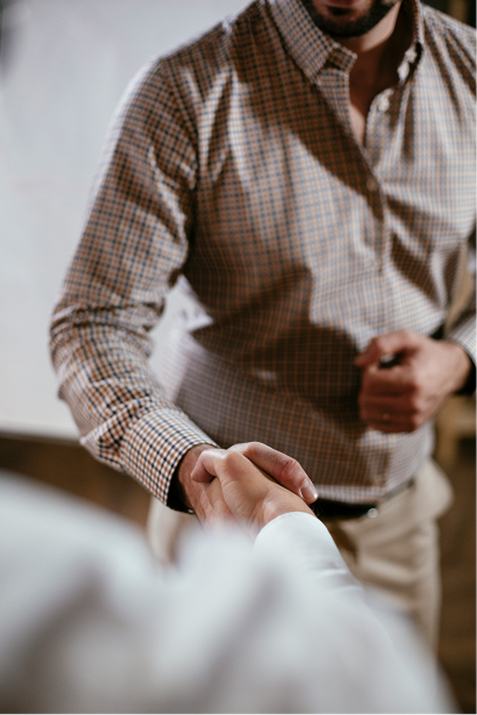 2 men shaking hands after coming to an agreement