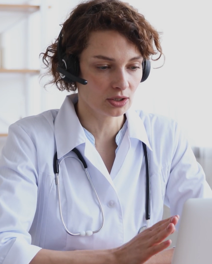 Images of a smiling woman at a kitchen table engaging with an HCP. From the iTC app. 