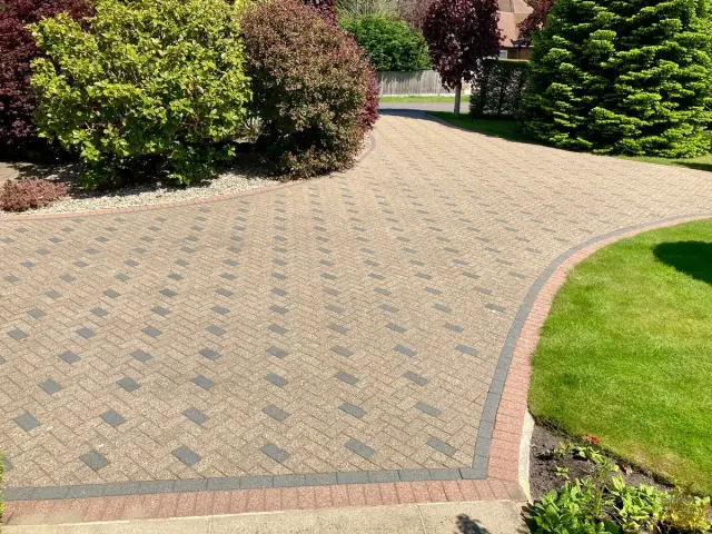 Driveway after GreenThumb Hard Surface Treatment, showing restored colour and a clean, refreshed finish.