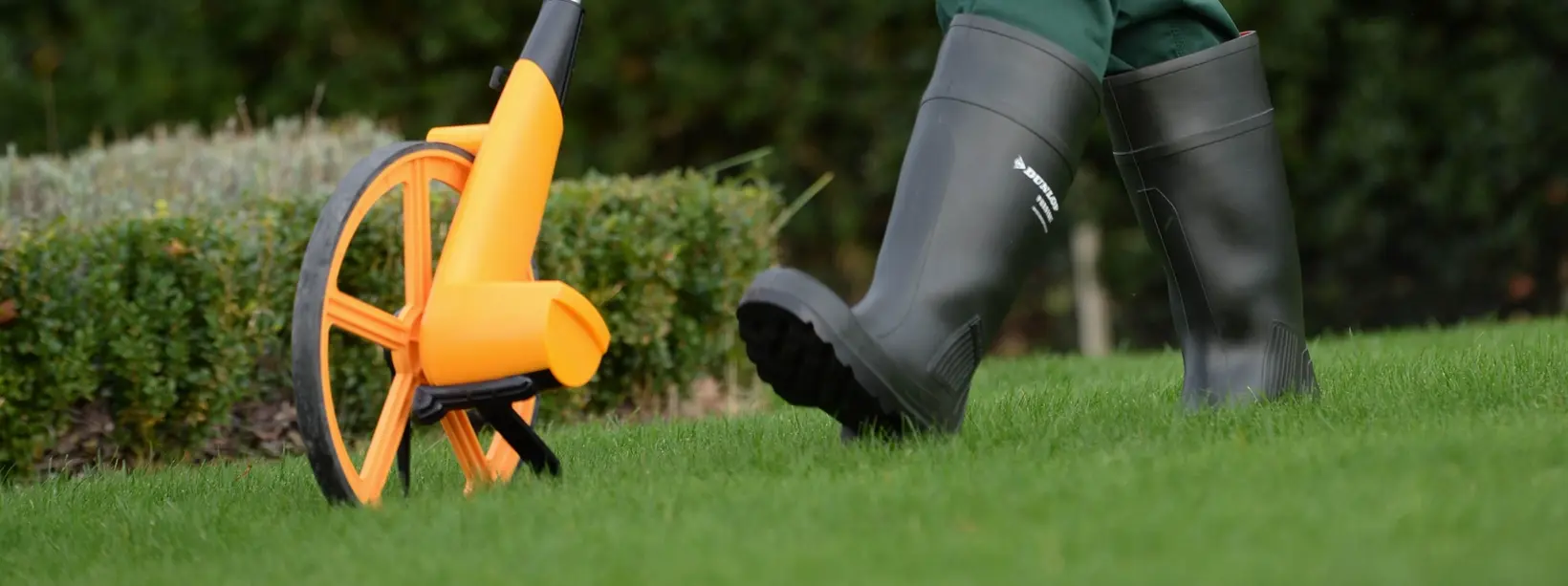 GreenThumb Lawn Operative measuring a lawn