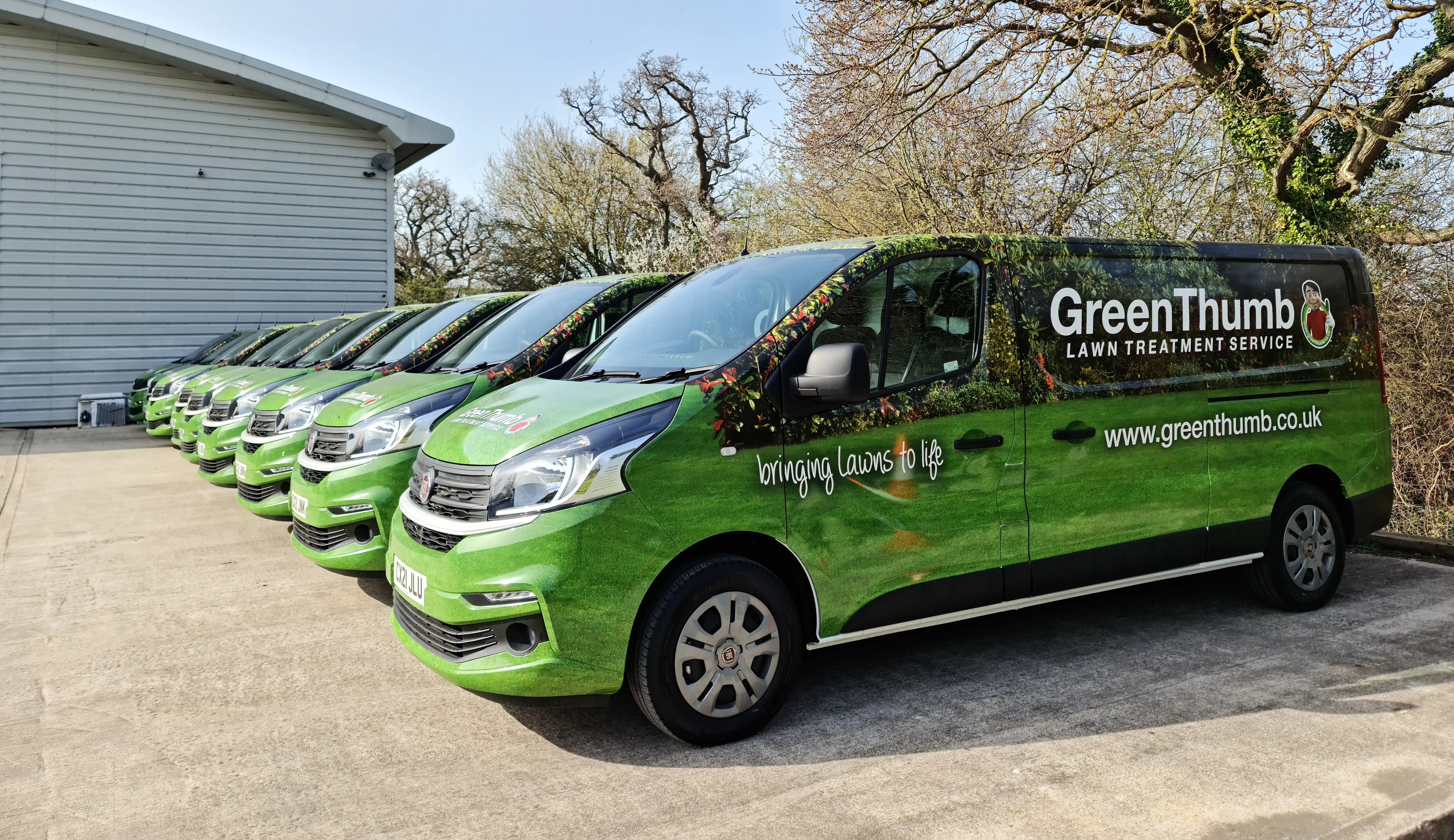 GreenThumb vans lined up in a car park