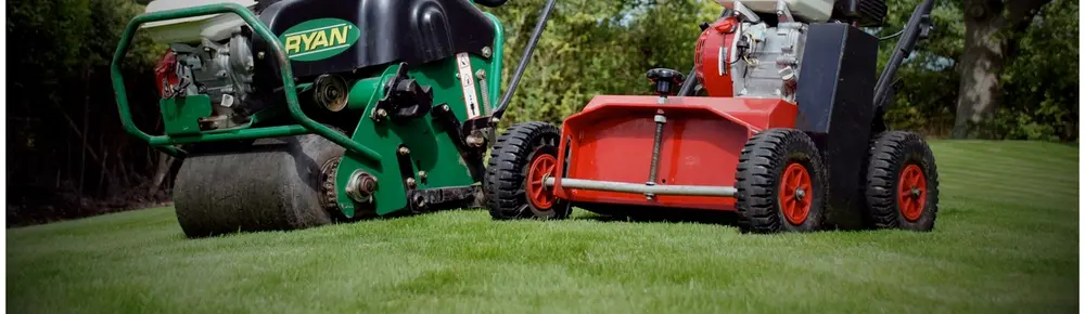 Lawn care machinery performing aeration and scarification to improve grass health and remove moss and thatch