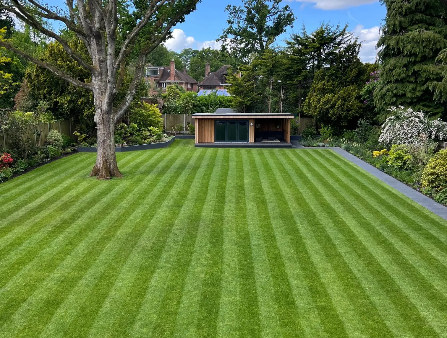 lush grass treated by GreenThumb with stripes mowed