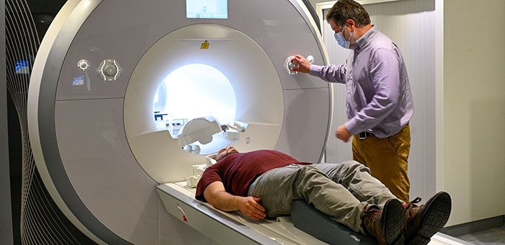 A photo of a participant entering the MRI Scanner