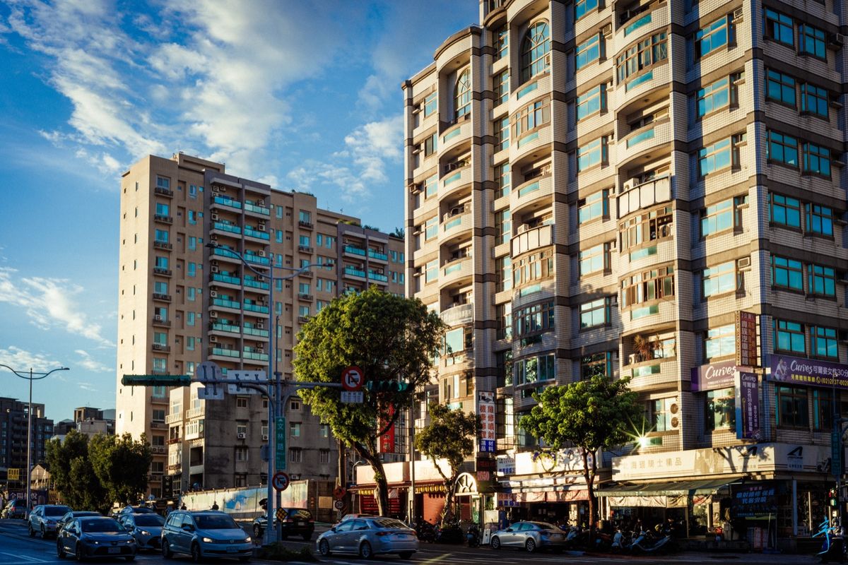 Apartment blocks above street-level shops in Shilin, Taipei