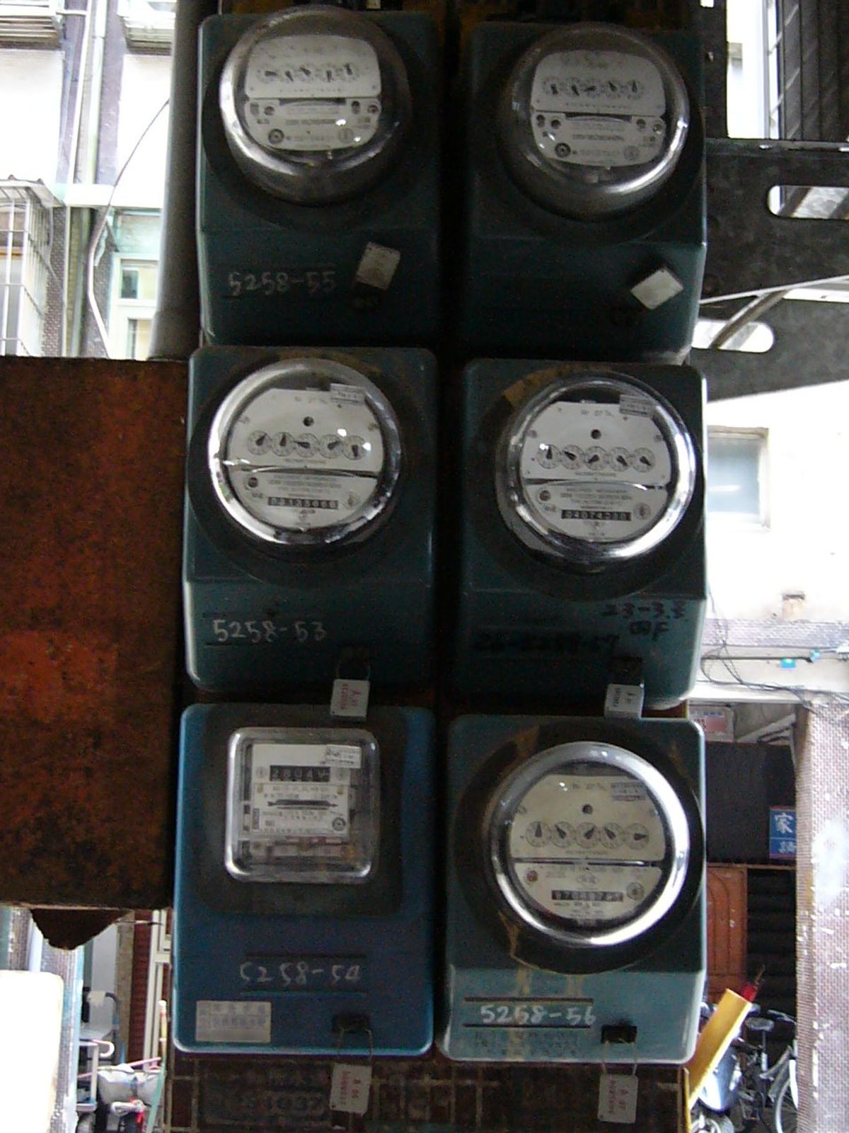 A row of Taipower electricity meters mounted on a wall in Taiwan