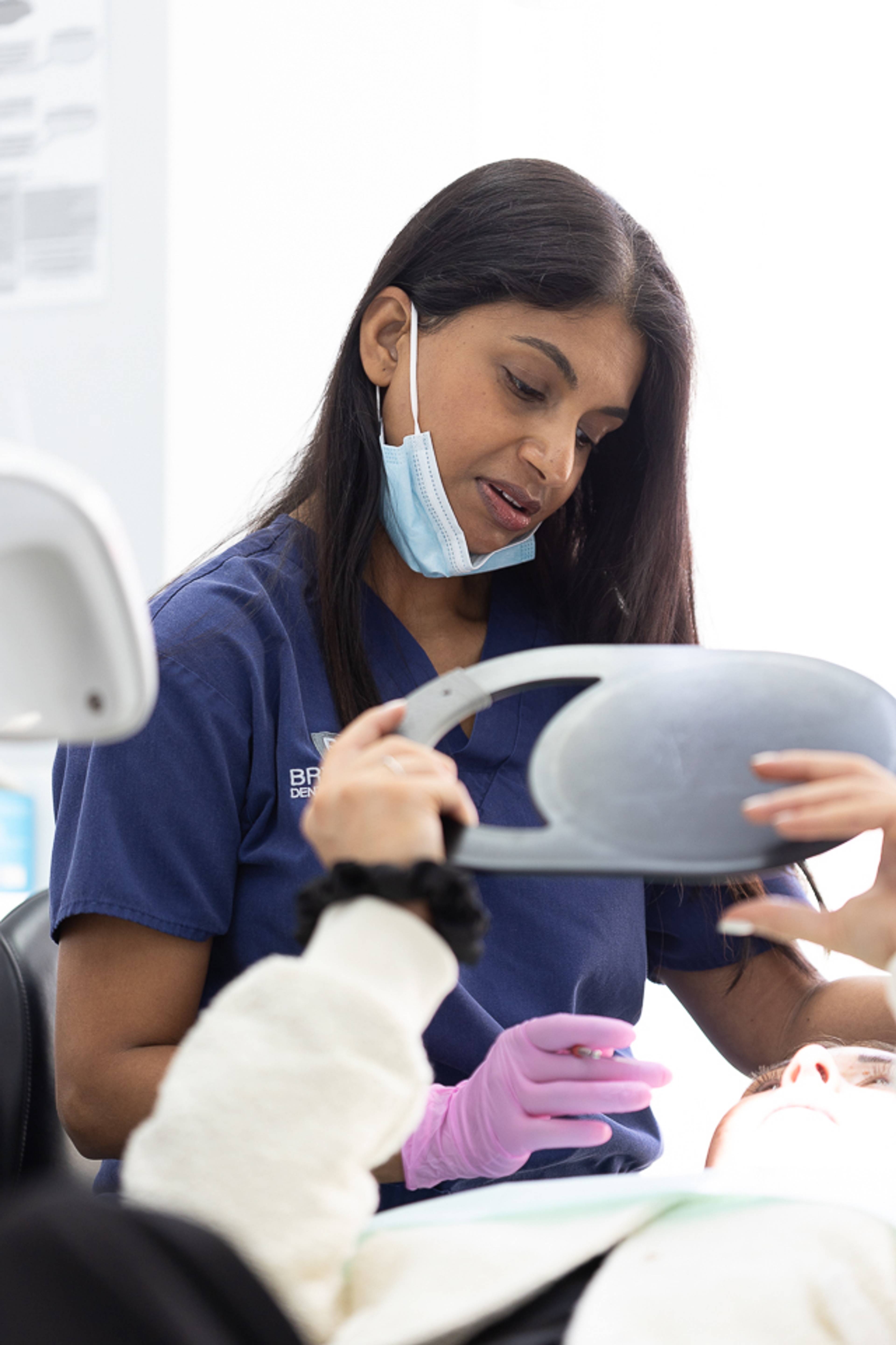 Dentist & patient discussing treatment