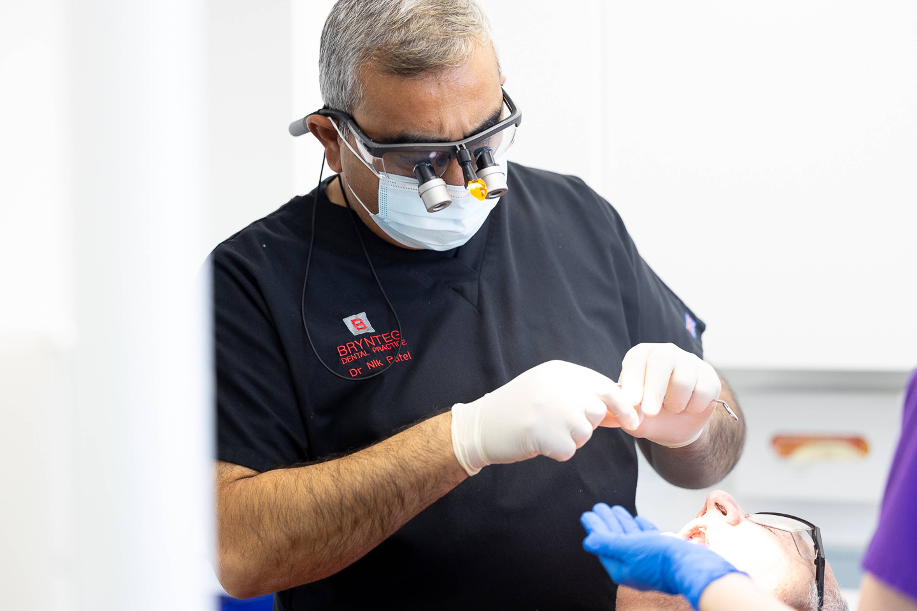 Dentist performing a treatment on a patient