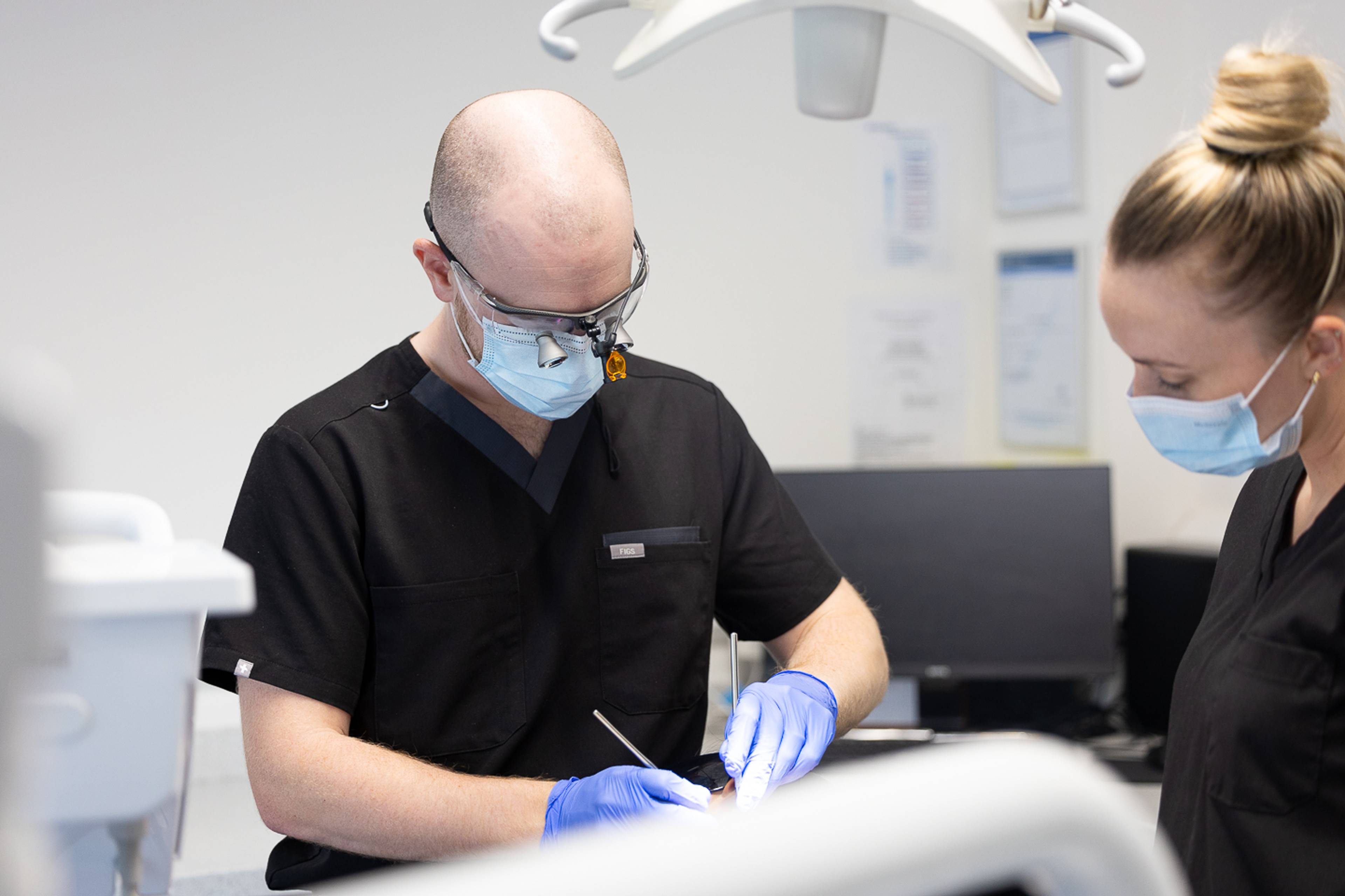 Dentist performing treatment at Brynteg Dental