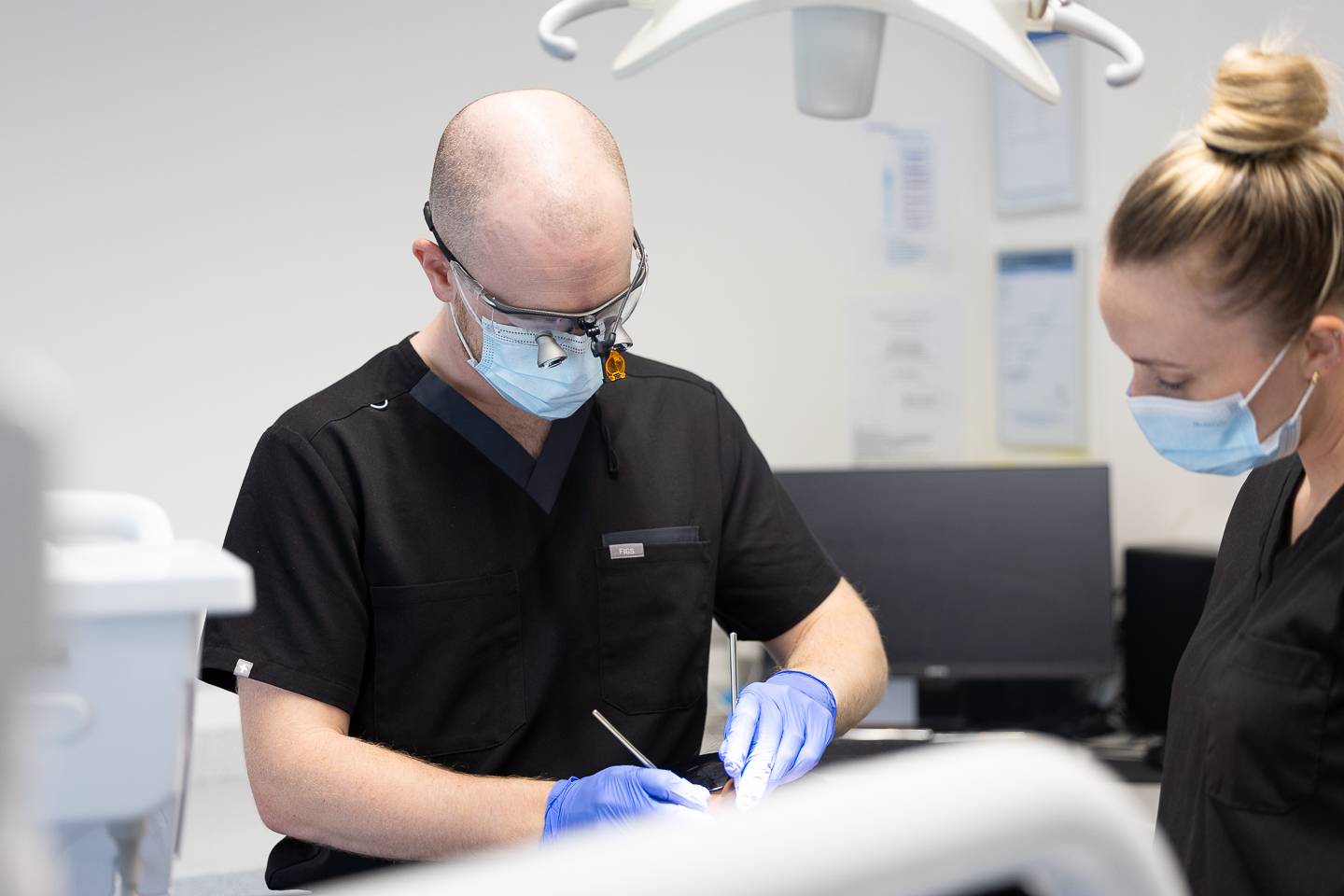 Dentist performing treatment at Brynteg Dental