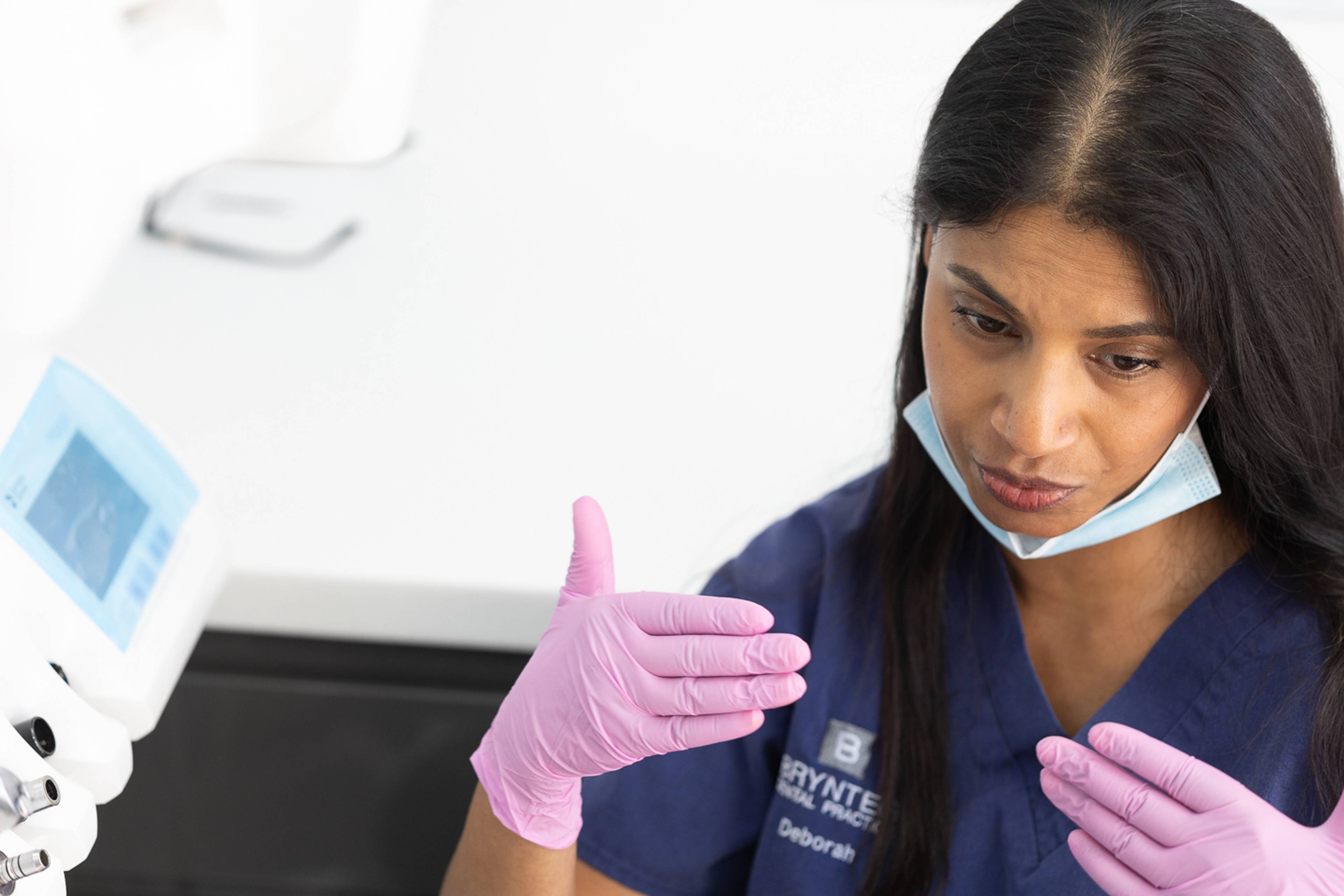 Dentist explaining implant treatment