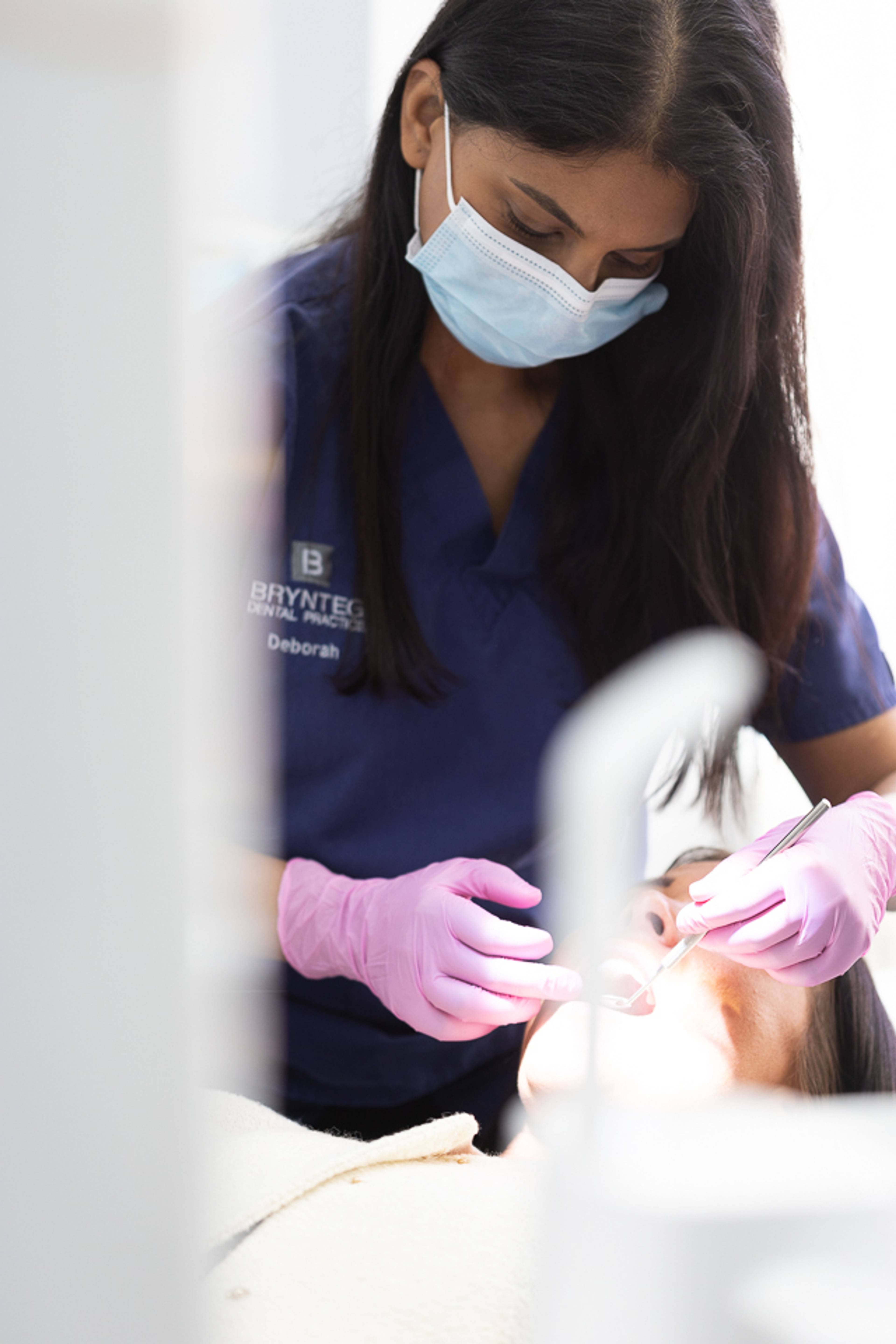 Dentist treating patient at Brynteg Dental