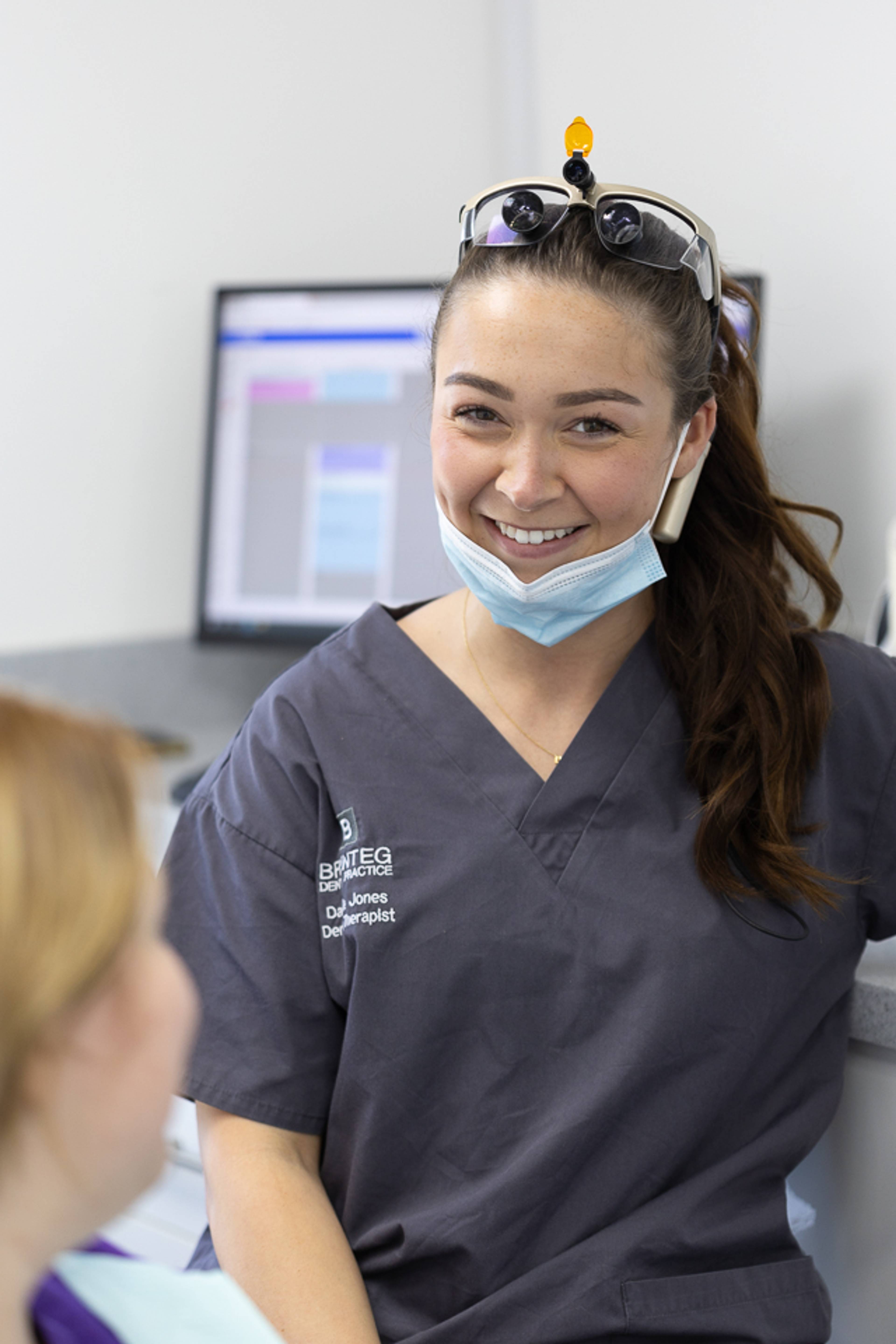 Clinician discussing tooth whitening with patient